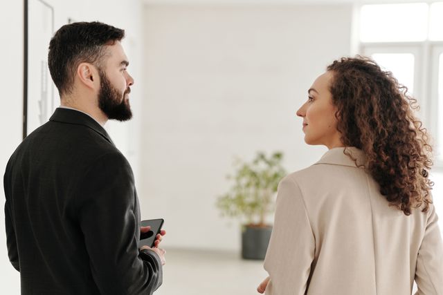 two people engaging in conversation indoors